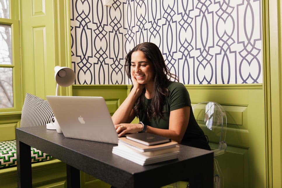Women looking at computer and smiling