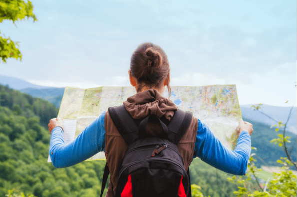 woman looking at a map that represents the customer journey
