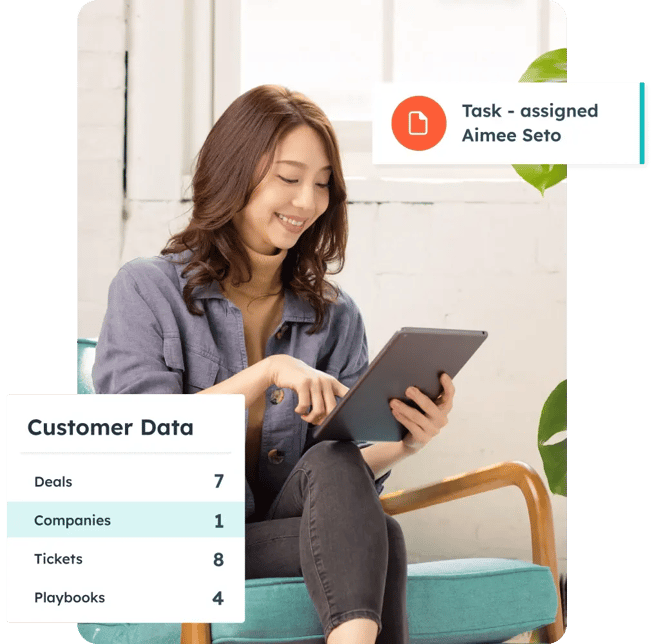 HubSpot user viewing customer metrics in HubSpot, including deals, tasks, companies, tickets, and playbooks