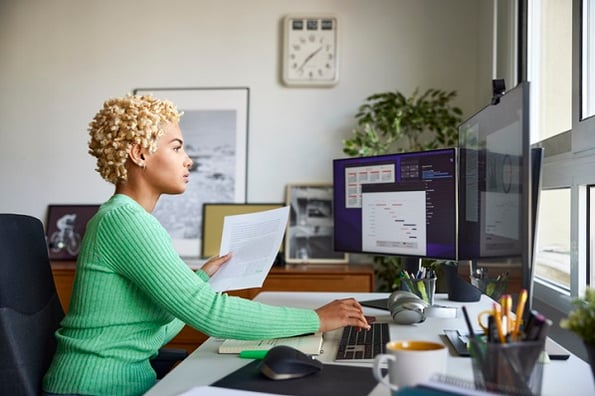 Woman diligently studying the JavaScript string split method and how it works.