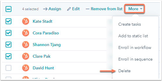 Screenshot of a HubSpot list with the 'More' dropdown menu open, showing 'Delete' as an option to delete selected contacts