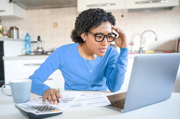 Woman working diligently to understand the behavior and use of JavaScript switch statements.