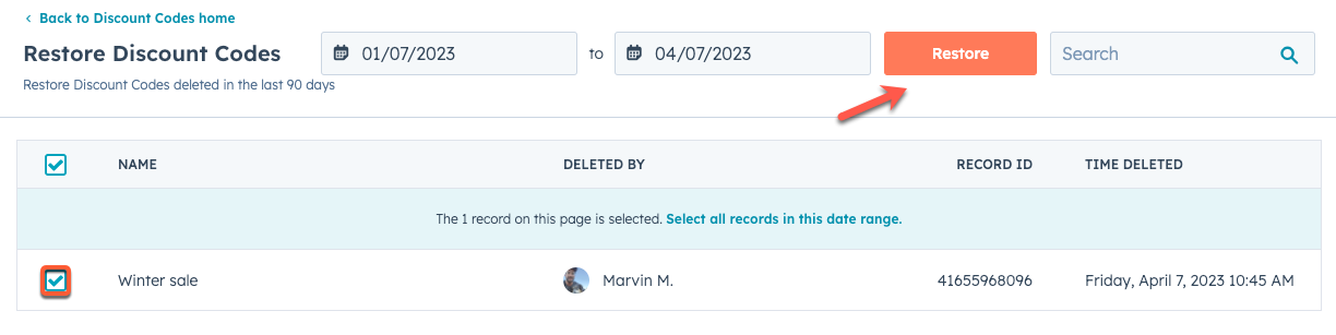 HubSpot 'Restore discount codes' screen showing a list of deleted codes with checkboxes and a 'Restore' button.