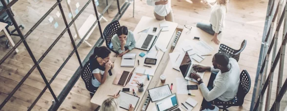 a team of internet marketers shown from above their desks