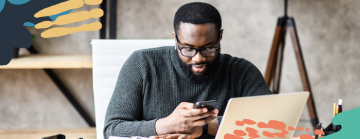 black male marketer reads marketing email from another business