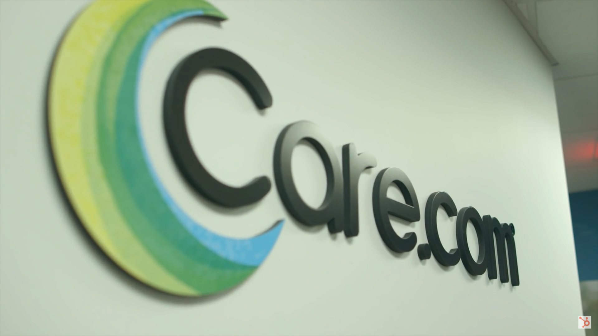 care.com logo on white wall