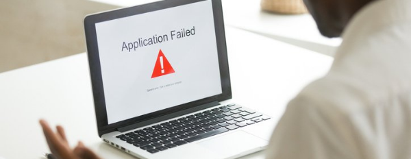 a web developer sees an application error page on their laptop after making a website mistake
