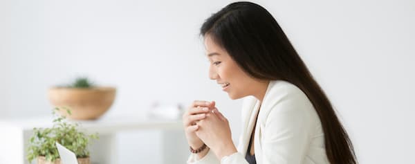 marketer sits at desk in front of a computer to prepare an A/A test