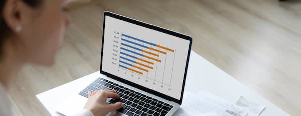Marketing manager works on business budget worksheet