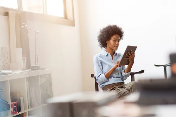 Person on tablet reading how to clone GitHub repository.