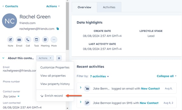 A HubSpot contact record for 'Rachel Green'. The 'About this contact' section shows an 'Actions' dropdown menu. A red arrow points to the 'Enrich record' option within this menu.