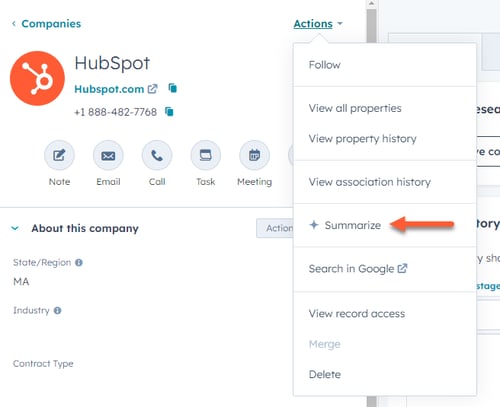 A HubSpot company record for 'HubSpot' showing an open 'Actions' dropdown menu. An orange arrow points to the 'Summarize' option within the menu.