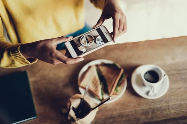 Woman making an Instagram Story Highlights