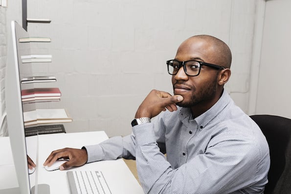 Person on computer learning how to use javascript onclick event