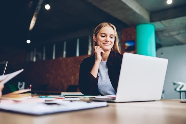 long form of essay marketer writing long-form content on laptop