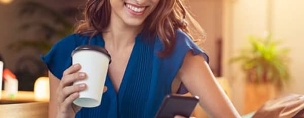 Marketer reading tips for writing good email subject lines on their phone