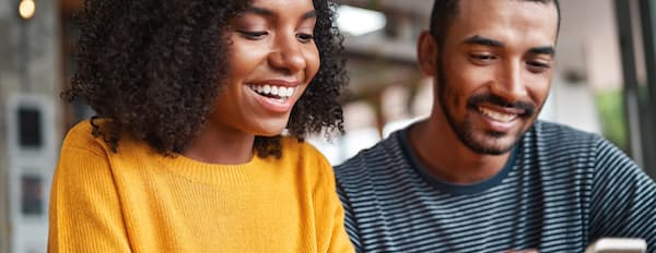 two consumers laugh at a funny ad