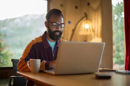 marketer on laptop reading about meta tags