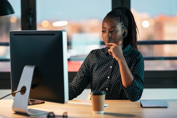 Young woman studying the Python Lambda and discovering how it can improve her software development code.