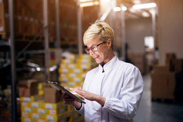 small business owner standing in warehouse