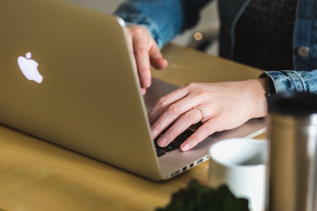 Woman reviewing Outlook vs. Gmail & which is better for her