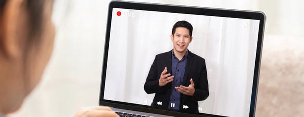a decision-maker reviews a pre-recorded virtual marketing campaign pitch